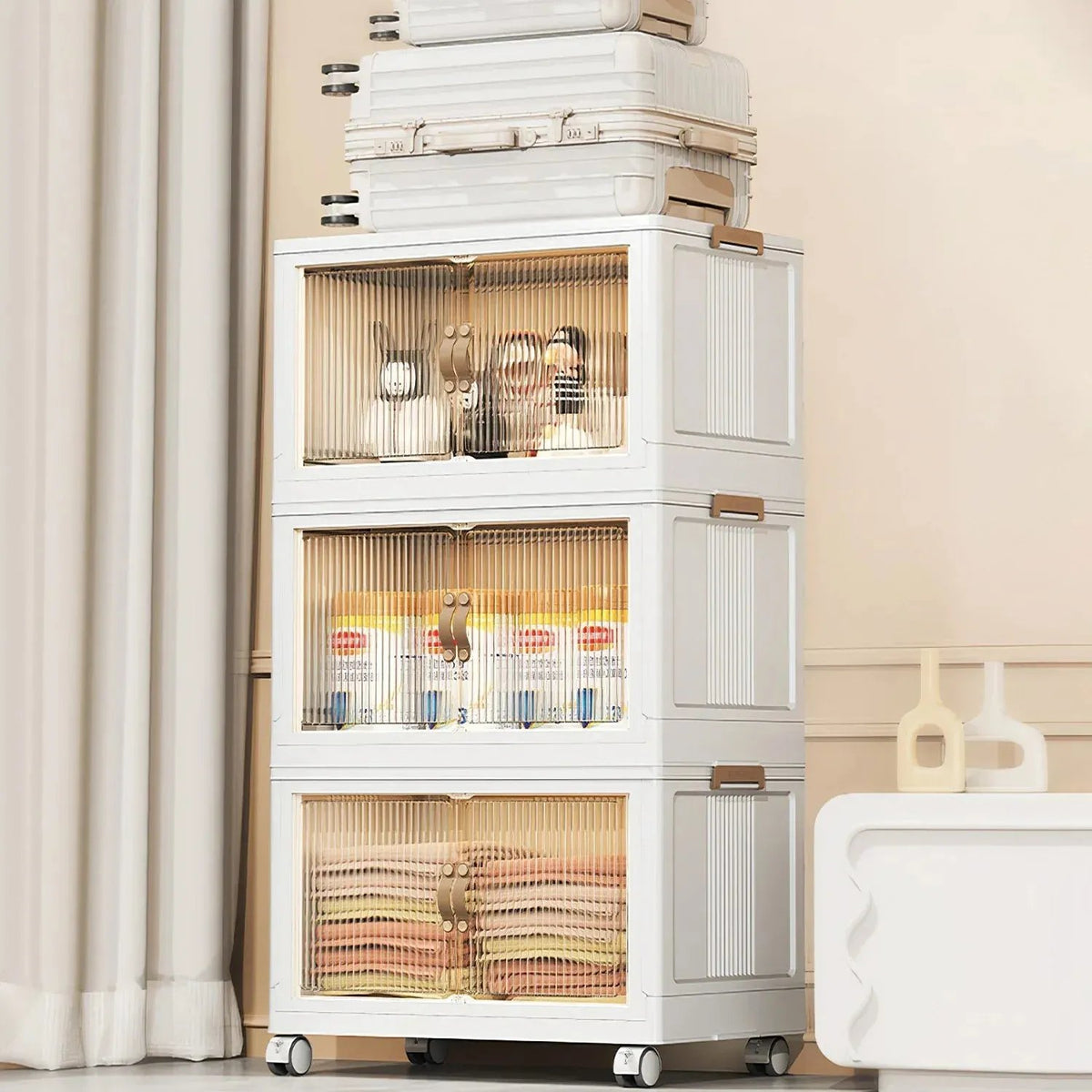 Stacked bins beside a sofa with folded components placed on top