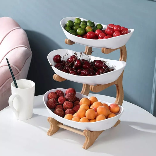 Three-tier fruit stand with white bowls and shaped frame