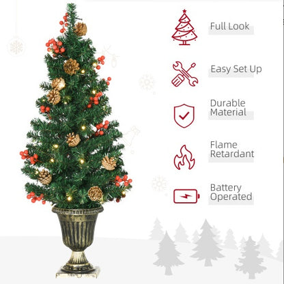 Potted artificial tree with berry accents
