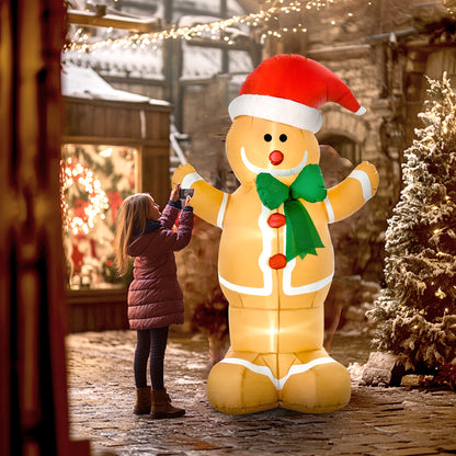 Person beside illuminated gingerbread display