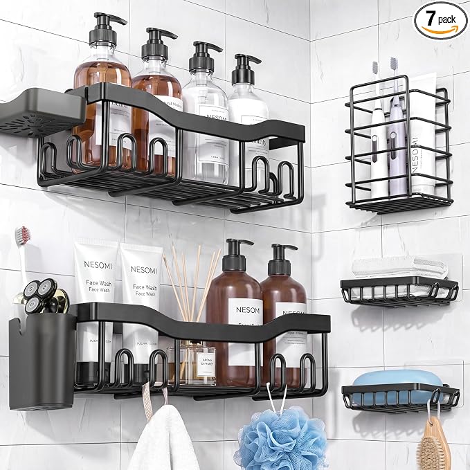 Black seven-piece shower storage arrangement on tile
