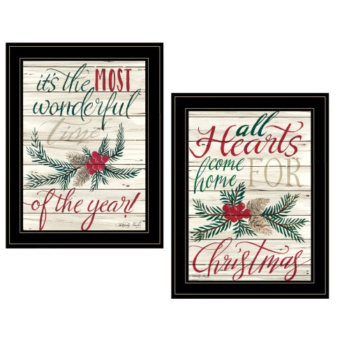 Pair of black-framed Christmas lettering prints with botanical details