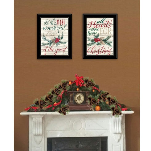 Two Christmas prints displayed above a fireplace
