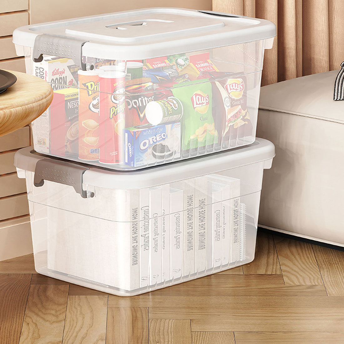 Two clear boxes holding packaged snacks and books