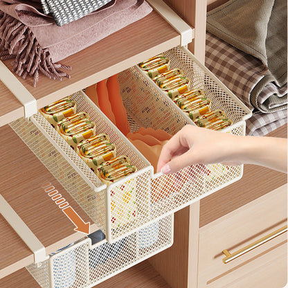 Basket pulled forward beneath a wardrobe shelf