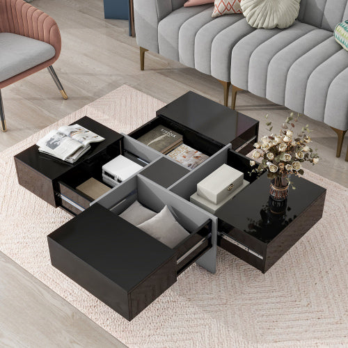 Black square coffee table with sliding storage panels open