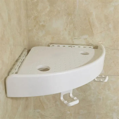 White fan-shaped shelf mounted in a bathroom corner